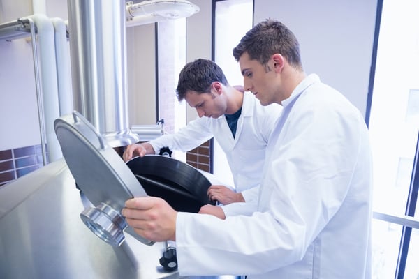 motion safety - scientists lifting lid in the factory