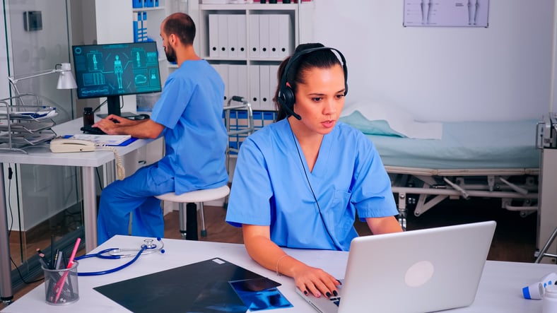 ergonomics in healthcare: Surgeon assistant using headphones in hospital answering to patients calls for appointments and consultations. Healthcare physician in medicine uniform, doctor nurse helping with telehealth communication