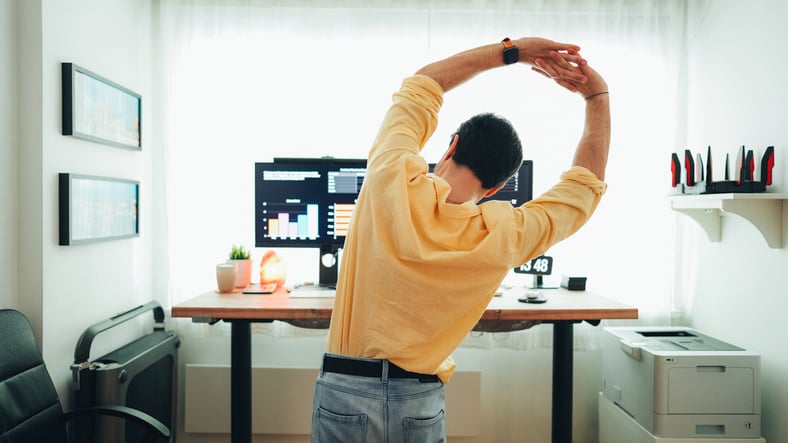 man stretching for ergonomic break