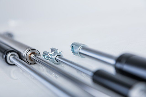 Gas spring installation components used in motion control applications