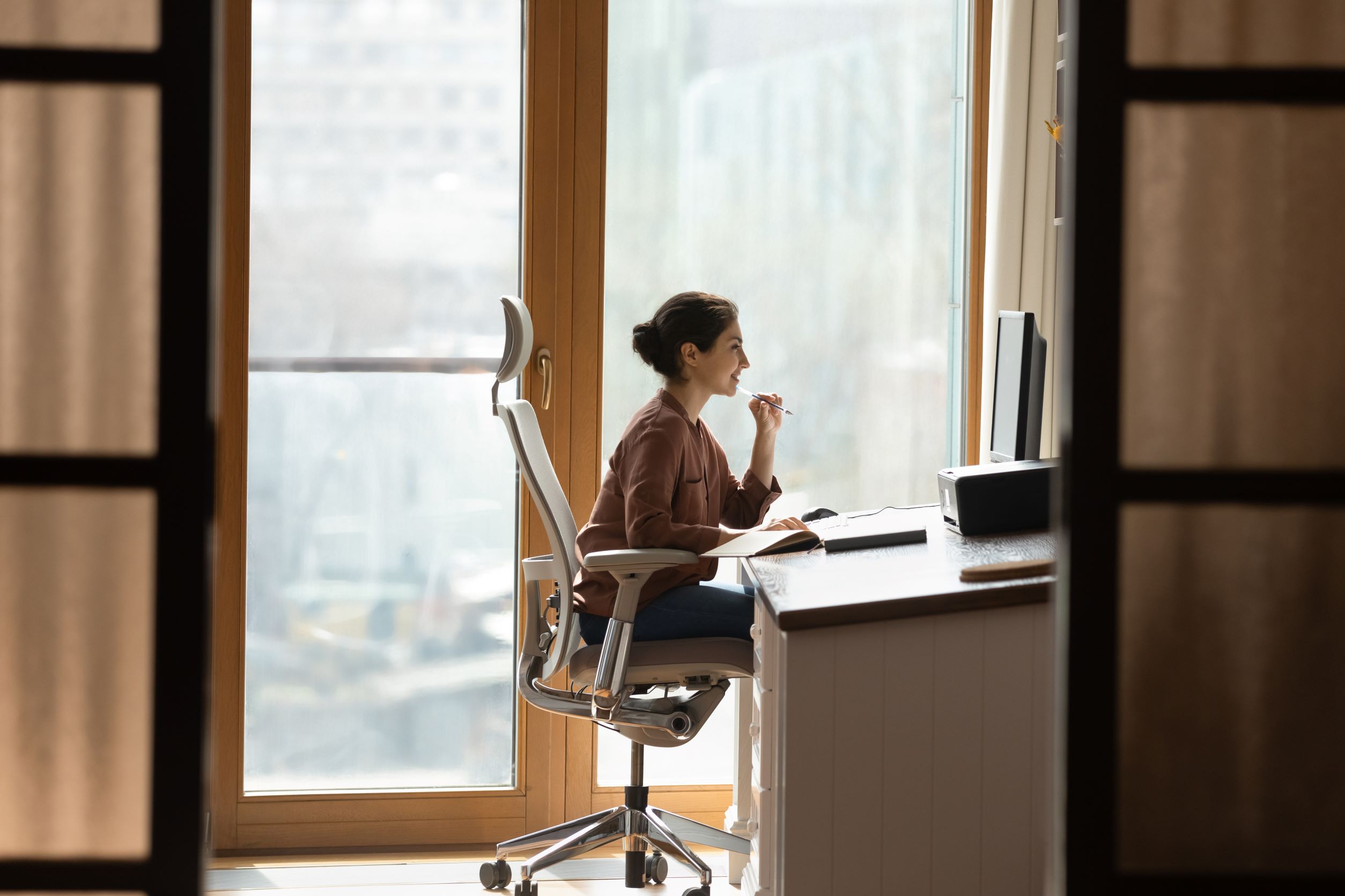 Woman at desk. Office ergonomics.
