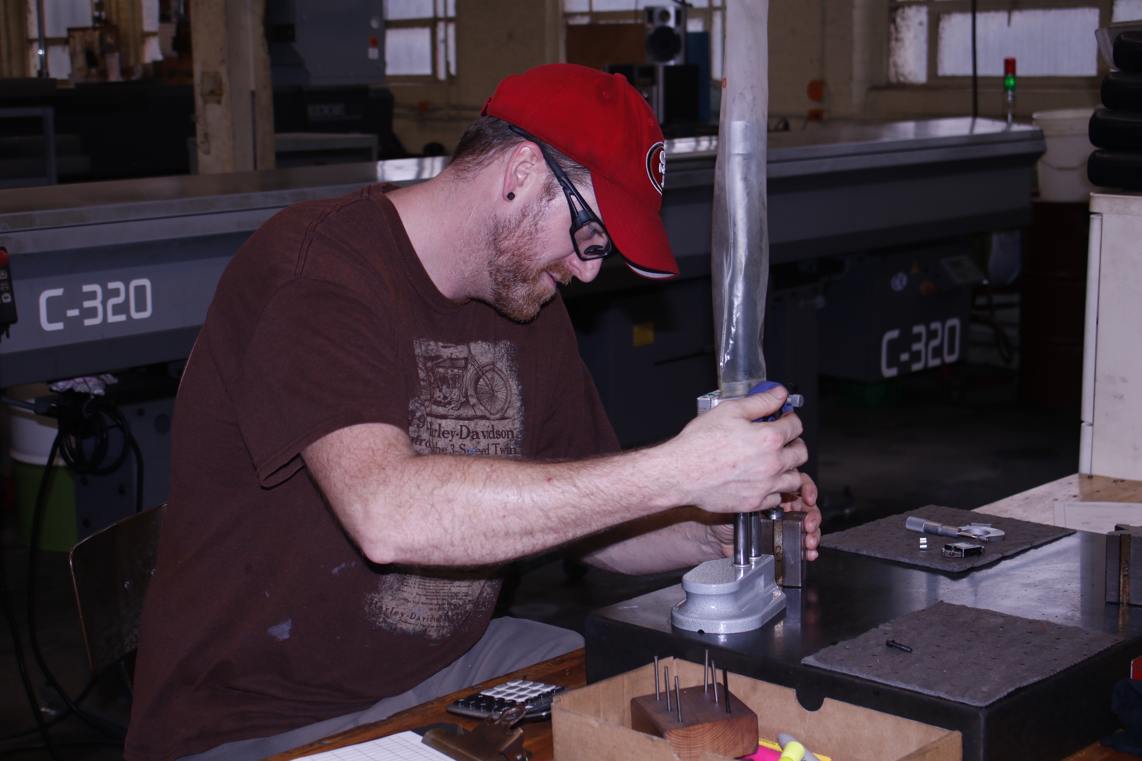 Man working at a machine. Weber Knapp Careers | Making Your Passion Your Work